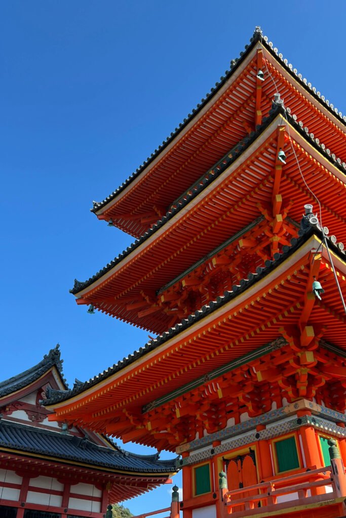 Historic Japanese temple in Kyoto with trees and traditional architecture