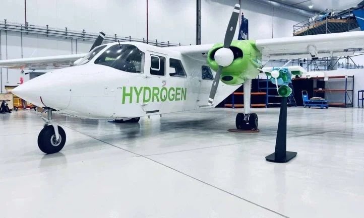 Futuristic hydrogen-powered aircraft at a sustainable green aviation terminal in the UK